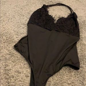 Crossed back body suit